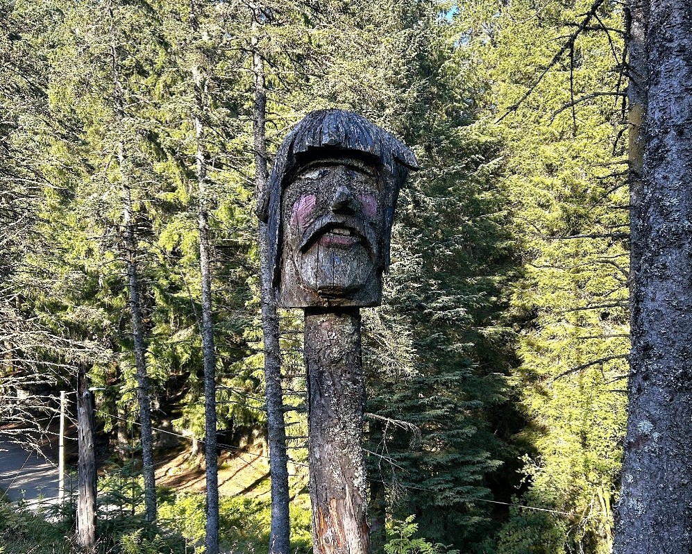 Wooden carved face on pole